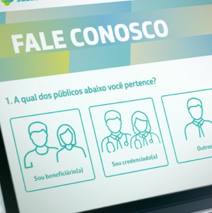 Tela de um computador mostra uma imagem com título “Fale conosco” e ícones de pessoas.